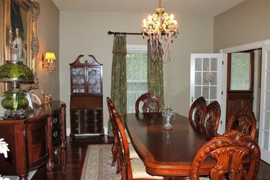 Dining Room with antique light fixture and sconces