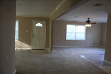 Hall looking into living room and den areas