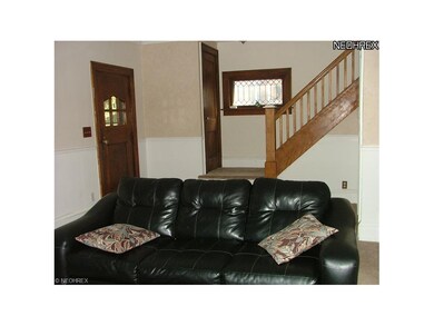 Front door, guest closet and staircase to the 2nd 