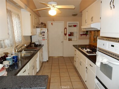 Open and bright kitchen. Door leads to the garage and laundry.