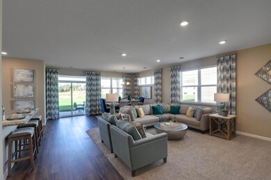 Large open living room, creating the perfect space to host friends and family. *Pictures are of model home, colors and finishes may vary. *