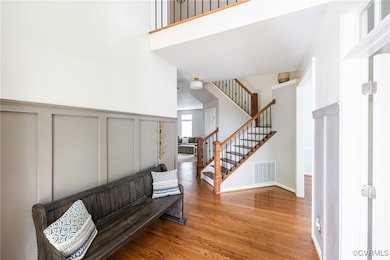 Wide and open two story foyer with custom accent w