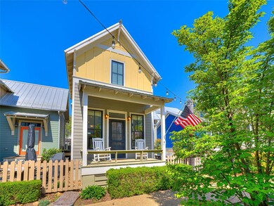 View of front facade with board and batten siding,