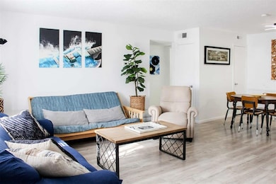 Living area featuring wood finished floors and baseboards