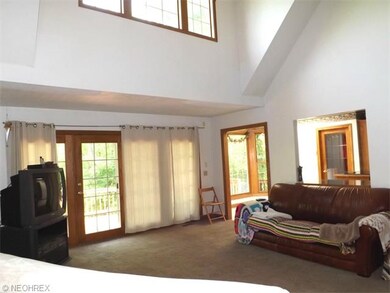 Living Room w/ Vaulted ceiling & Deck access. Pass