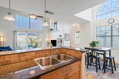 Kitchen with ceiling fan, open floor plan, a weal