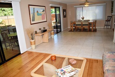 Open living features two glass doors leading to th