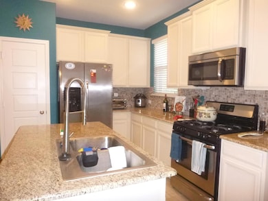 Kitchen featuring appliances with stainless steel