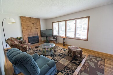 Living room has wood burning fireplace