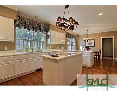 Kitchen. Kitchen features a sun filled room with w