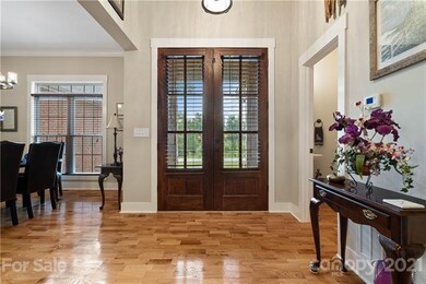 Foyer - 12' ceilings, 8' stained wood doors