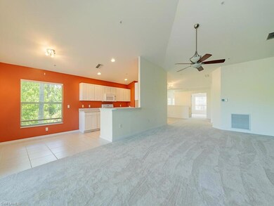 Unfurnished living room with light carpet, ceiling