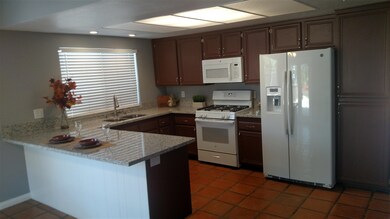Beautifully updated kitchen with granite counter t
