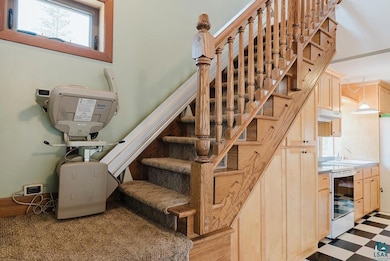 Stairs featuring tile patterned floors