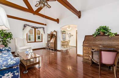 Formal living room with beamed ceiling
