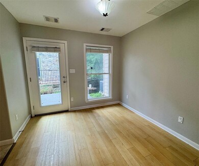 Doorway to outside featuring baseboards and light