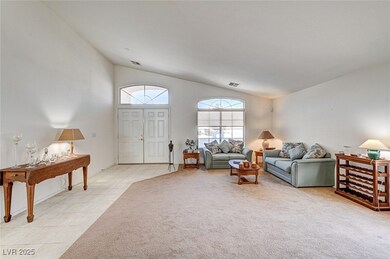Living room featuring light tile patterned floors,