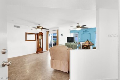 Living room featuring ceiling fan