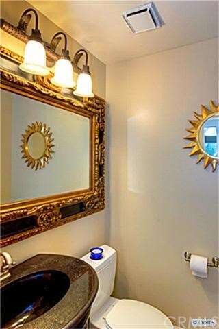 Handsome Downstairs Powder Room with Furniture Sty