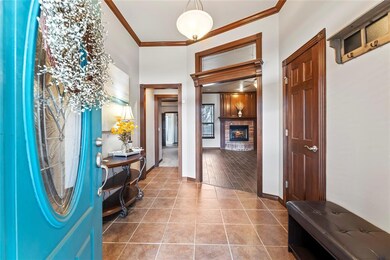 Entrance foyer with tile flooring and ornamental m
