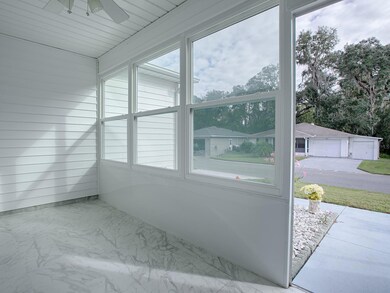 ENJOY A GORGEOUS DAY FROM THE GLASS FRONT PORCH ENTRANCE ENCLOSURE!