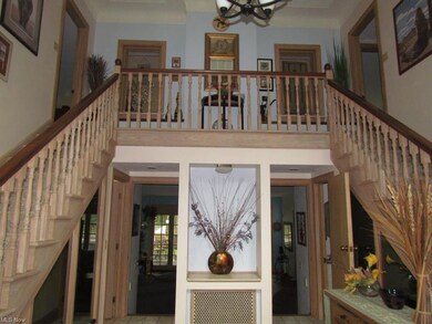 Main entry with 2 staircases to 2nd floor