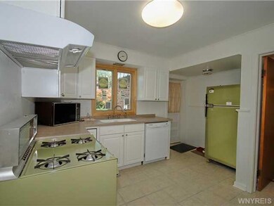 Kitchen Back door to enclosed entry way and porch