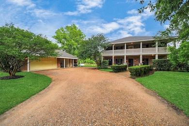 A crushed granite gravel driveway and walkway enha