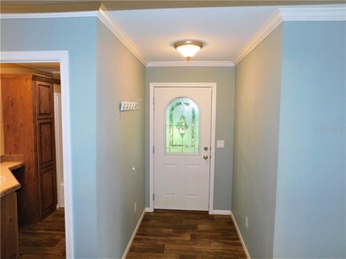 BEAUTIFUL ENTRYWAY FROM COVERED CARPORT