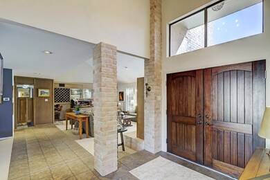 Double door entry with transom lighting above open