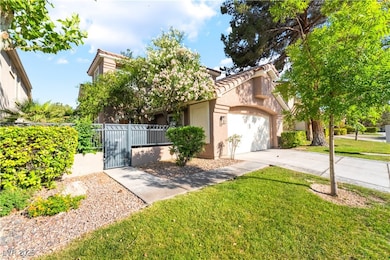 View of front of home with a tile roof, driveway,