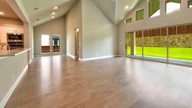 Unfurnished living room with hardwood / wood-style