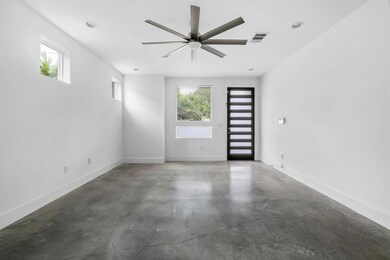 Empty room with finished concrete flooring, a cei