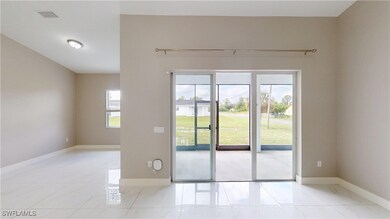 Doorway featuring baseboards