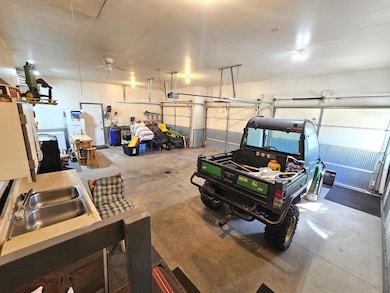 Spacious garage with hot and cold water.