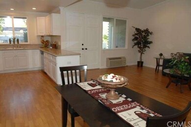 The spacious dining area opens to the living room 