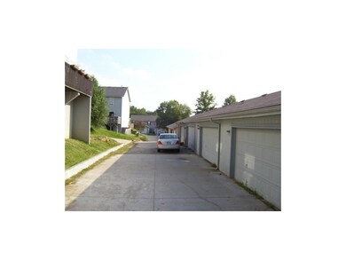 Alley behind property showing 2 car garages.