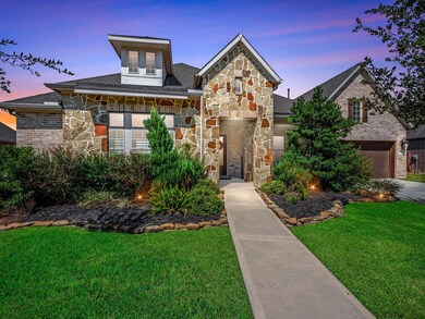 country club inspired landscaping, stone elevation