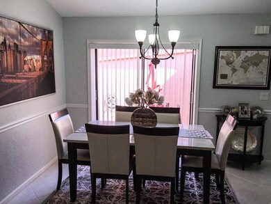 Dining Room & Sliders to Outside Covered Front Pat