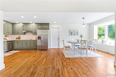 Kitchen featuring appliances with stainless steel