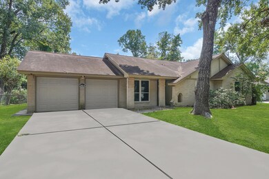 Two-car garage with a wide driveway for ample park