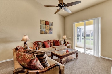 Living room with vaulted ceilings.