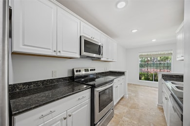 Modern kitchen with sleek black granite countertop