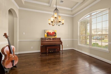 Large adequately illuminated by light formal dining room.