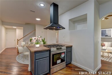 Virtually Staged; Kitchen with island range hood,