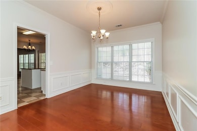 Unfurnished room featuring wood finished floors, a