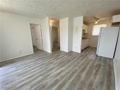 Unfurnished living room featuring light wood-type