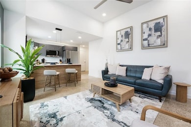 Living room featuring ceiling fan