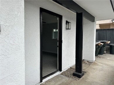 Doorway into  living room / or possible bedroom.