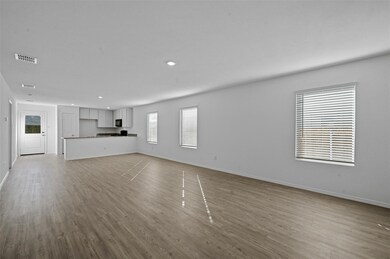 Unfurnished living room with light hardwood / wood